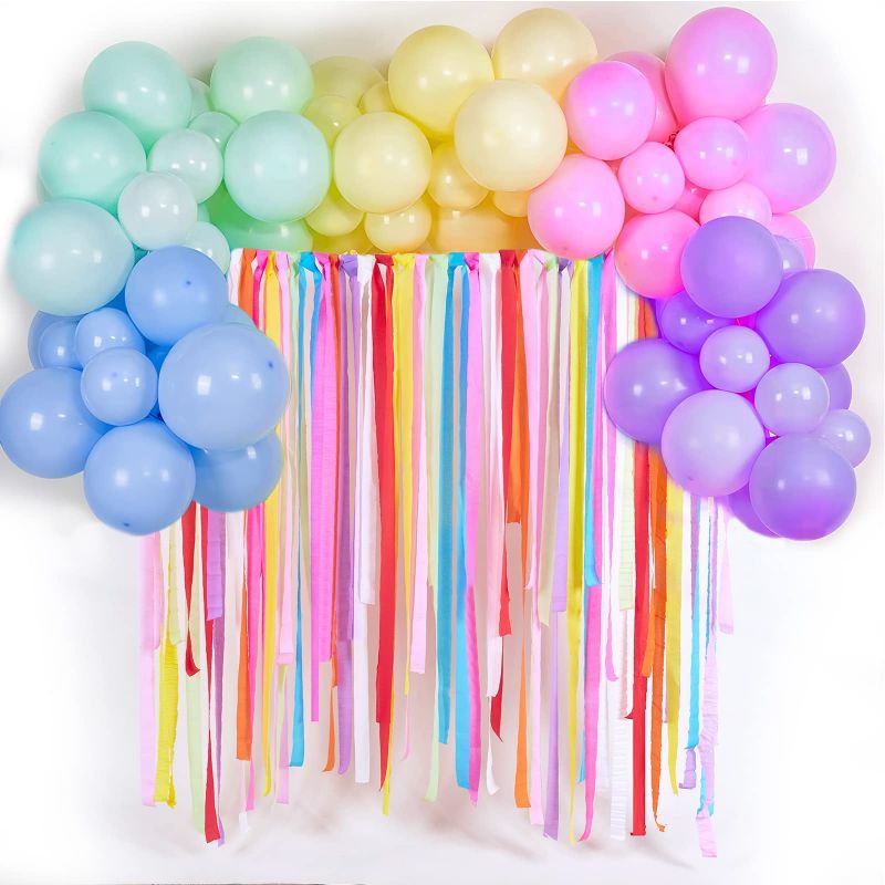rainbow colorful balloon arch and multicolored cerpe paper