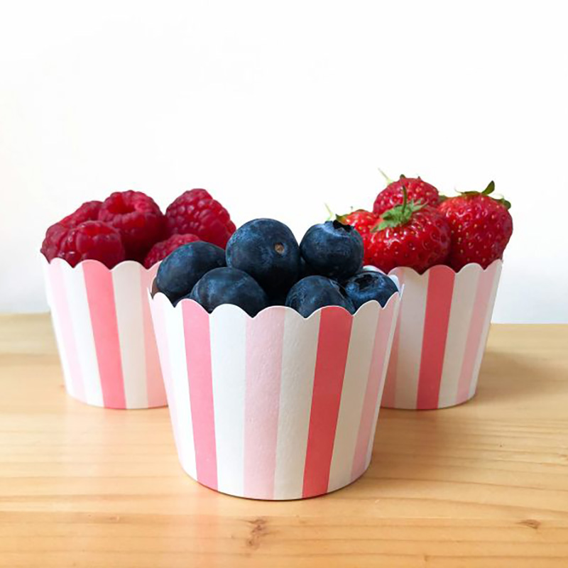 cupcake cases with raspberry, strawberry and blueberry