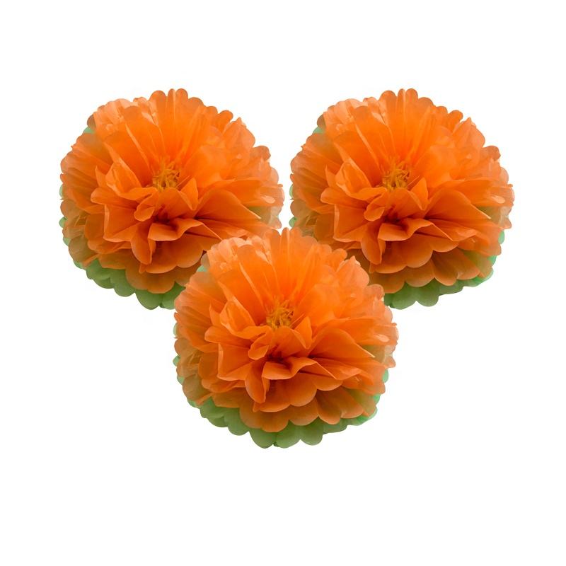 orange tissue pom poms