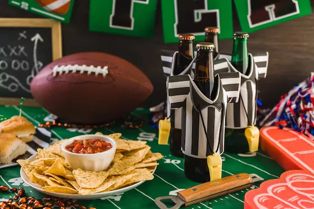 football party table with beer chips and salsa party decorations