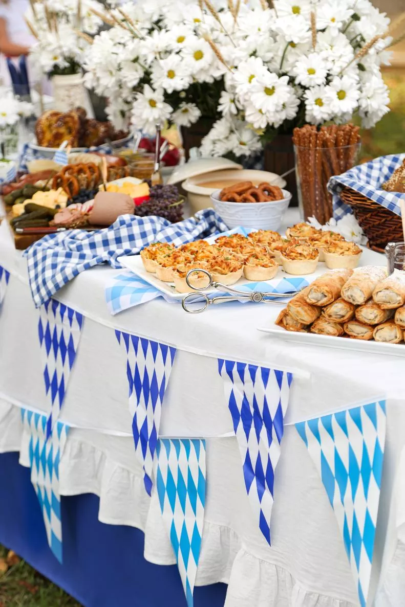 Oktoberfest kits: combine Bavarian flag banners, photo booth props, tableware sets