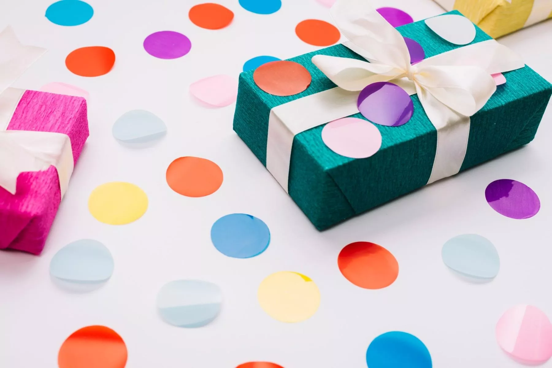 colorful confetti wrapped gift box with ribbon