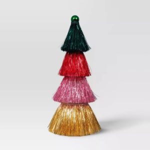 A tiered tassel tree with layers in green, red, pink, and gold colored tinsel, topped with a green colored ball.