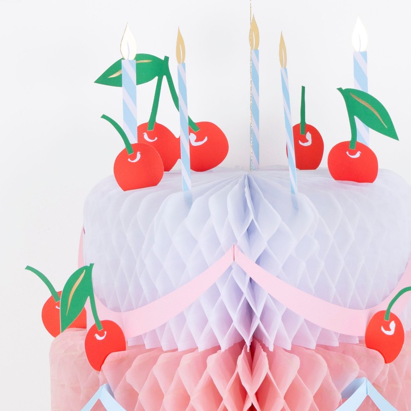 Close-up of cherry-topped honeycomb birthday cake decoration