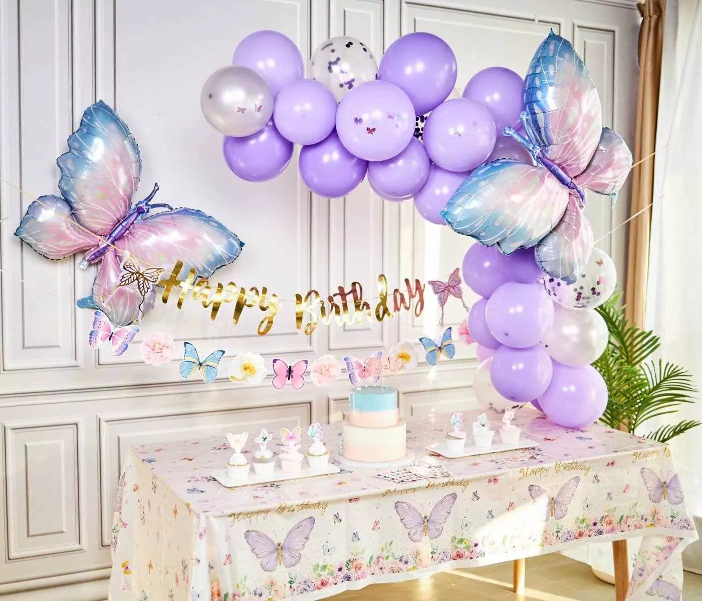 Purple butterfly birthday party, balloon garland and dessert table