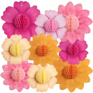 Assorted pink, orange, cream honeycomb paper flower cutouts with 3D honeycomb centers, hanging party decorations isolated on white background