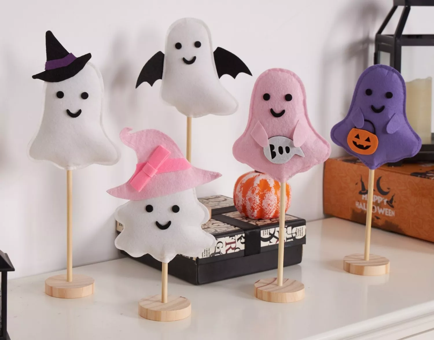 Cute ghost felt tabletop Halloween decor on white cabinet