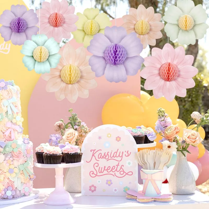 Pastel flower honeycomb paper hangings, boho girl birthday party dessert table lifestyle shot