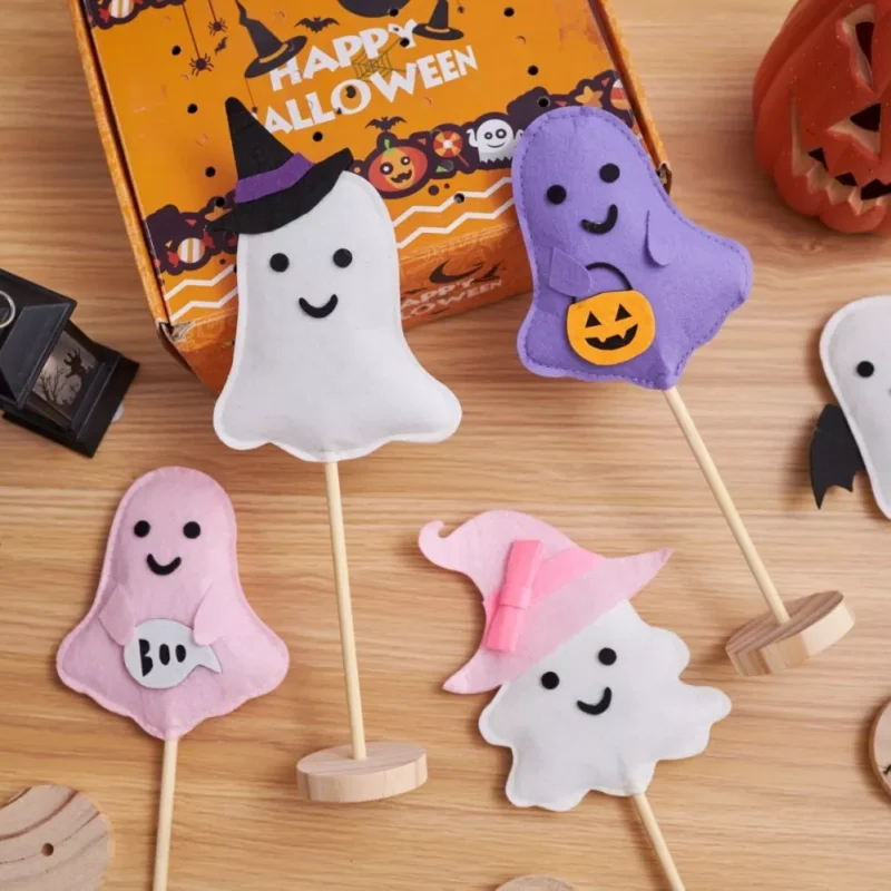 Flat lay Halloween felt ghost wooden stand decorations Flat lay Halloween felt ghost wooden stand decorations
